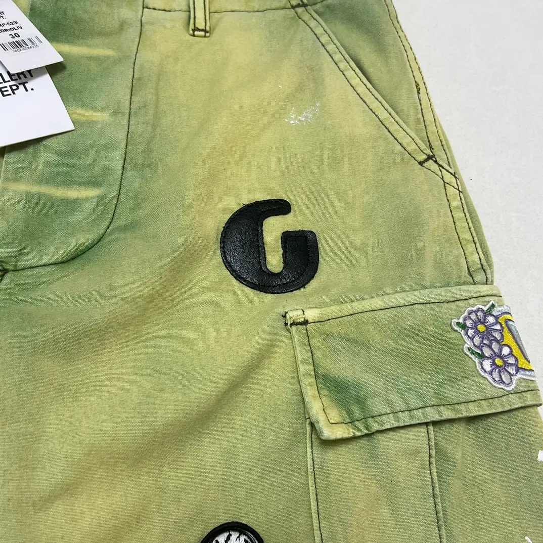 Super heavy duty! 10 embroidered stamps on full pants, one G leather stamp, GALLERY DEPT. KENZIE FATIGUE CARGO SHORTS, patch embroidered shorts, distressed splash-ink overalls, olive green size 30/32/34/36